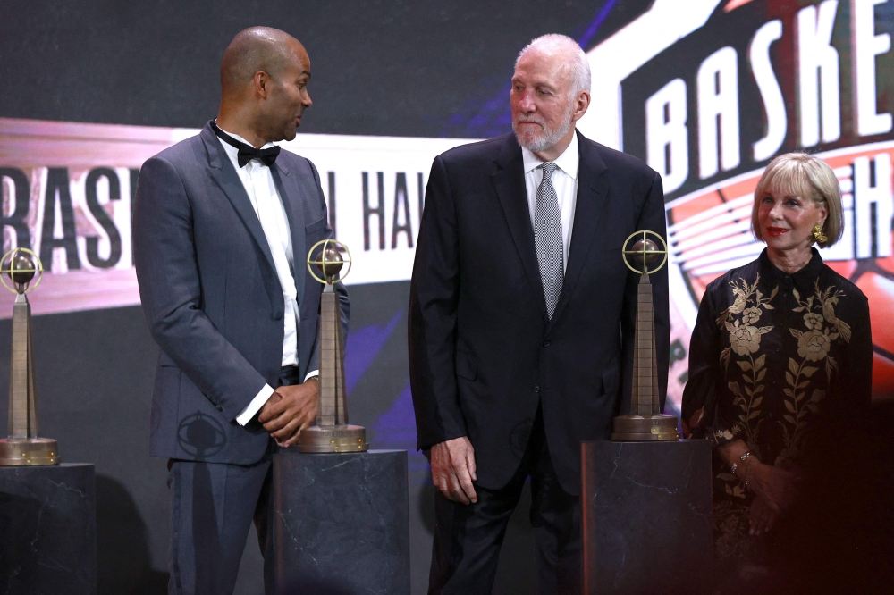 2023 inductees Tony Parker and Gregg Popovich react on stage during the 2023 Naismith Basketball Hall of Fame Induction at Symphony Hall on August 12, 2023 in Springfield, Massachusetts. Mike Lawrie/Getty Images/AFP (Photo by Mike Lawrie / GETTY IMAGES NORTH AMERICA / Getty Images via AFP)

