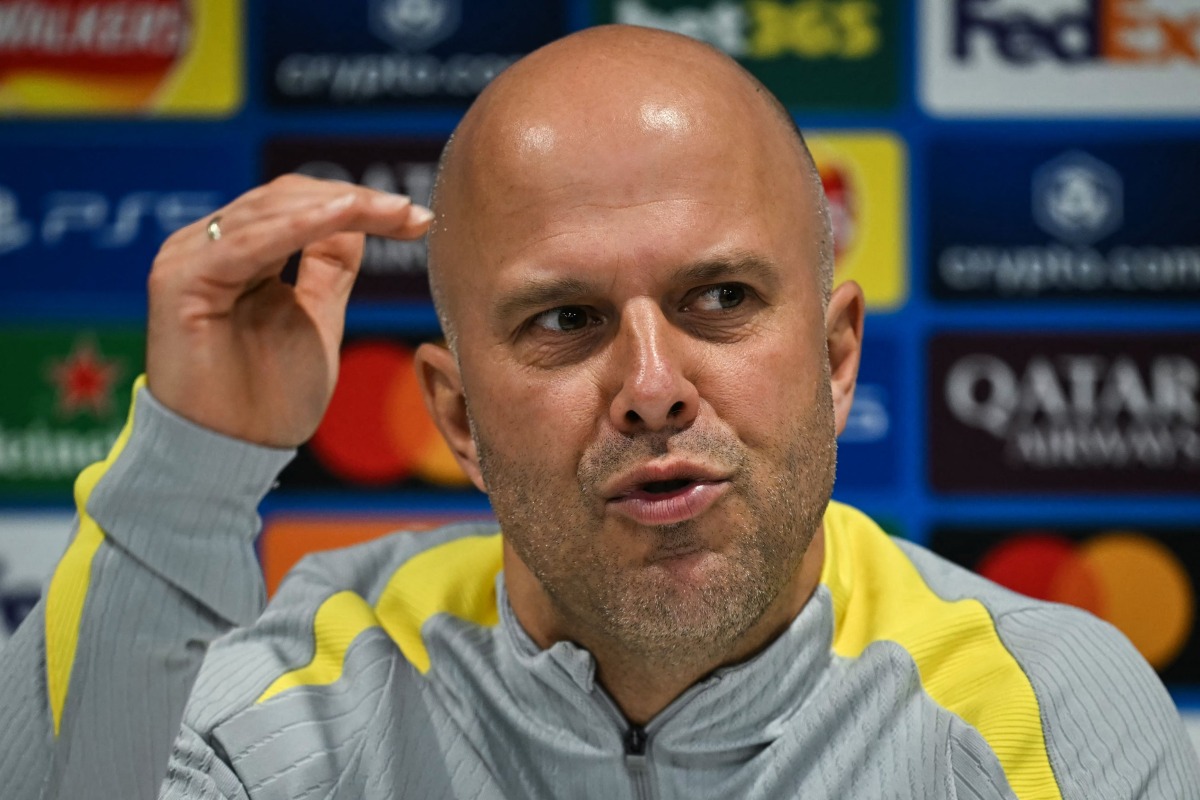 Liverpool's Dutch manager Arne Slot gestures as he speaks during a press conference, at the Anfield stadium, in Liverpool, north west England, on November 4, 2024, on the eve of their UEFA Champions League football match against Bayer Leverkusen. (Photo by Paul ELLIS / AFP)
