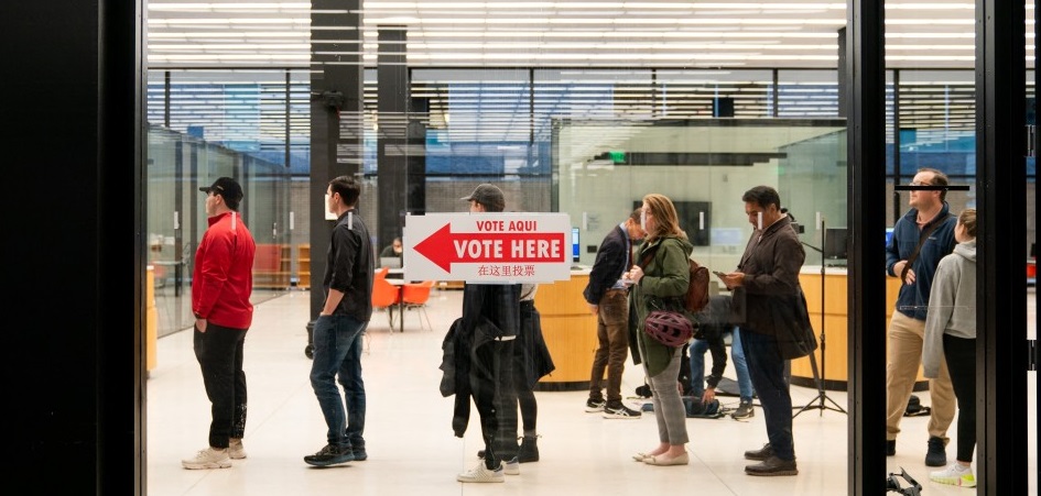 People wait in line to vote at a polling station at Martin Luther King Jr. Library in Washington, DC on Election Day, November 5, 2024. Photo by Allison ROBBERT / AFP.