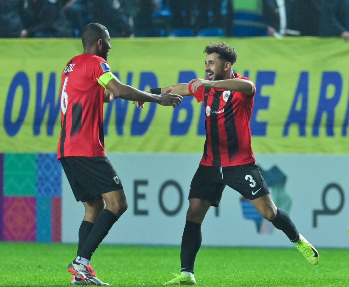 Al Rayyan’s Hazem Shehata (right) celebrates with captain Abdulaziz Hatem after scoring the goal.