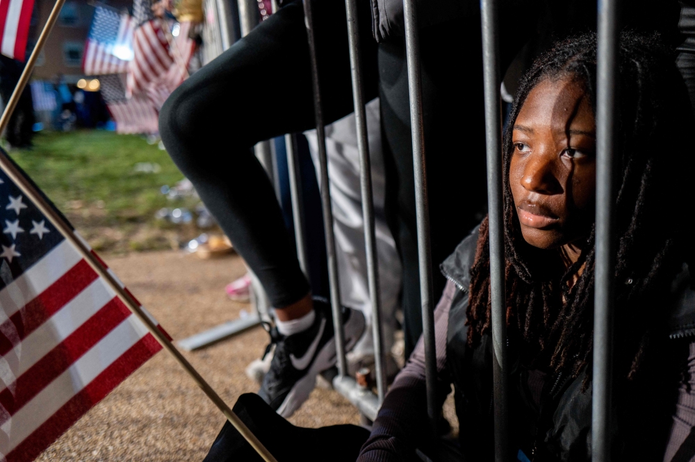 Howard University student Danielle Munford listens to polling results during an election night event on November 05, 2024 in Washington, DC. Brandon Bell/Getty Images/AFP 