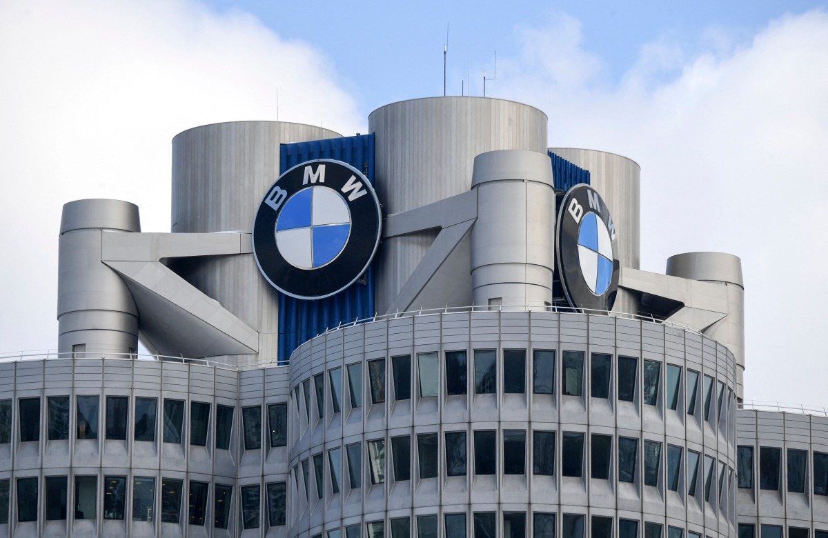 The BMW logo is seen on the top of the headquarters of German carmaker BMW in Munich on March 20, 2018. Photo by CHRISTOF STACHE / AFP