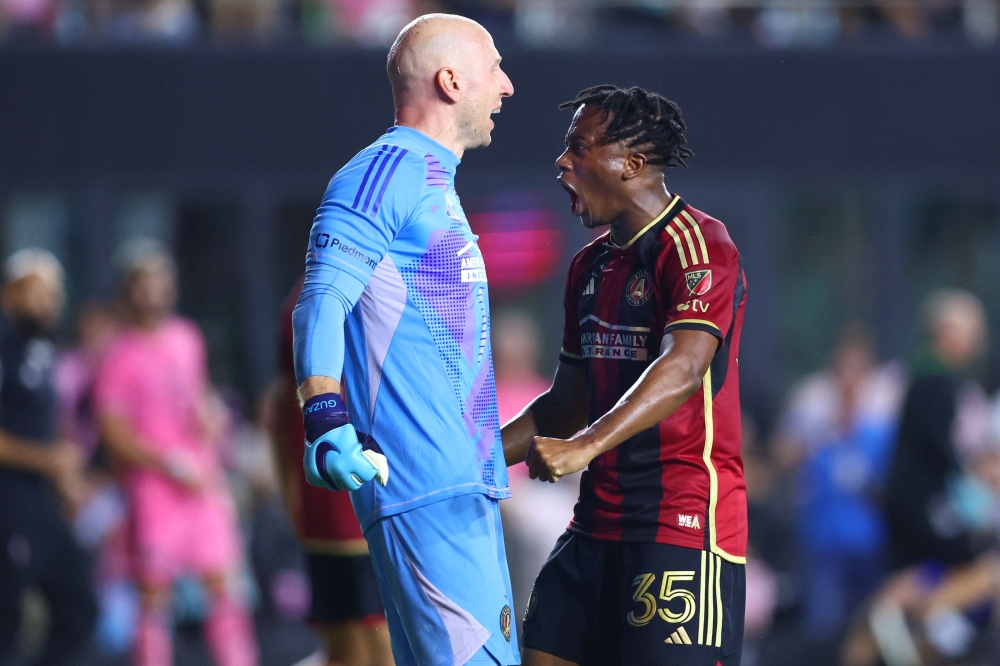 Brad Guzan #1 and Ajani Fortune #35 of Atlanta United celebrate after their team defeated Inter Miami on November 09, 2024 in Fort Lauderdale, Florida. Megan Briggs/Getty Images/AFP 