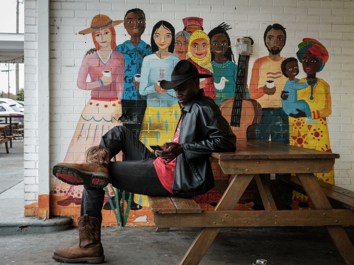 Photo used only for demonstration purposes. A 50-year-old Senegalese-American man, who got sent a message, sits at the Refuge Coffee, a nonprofit organization offering job training and other assistance to resettled refugees and immigrants, in Clarkston, Georgia, on November 7, 2024. Photo by Yasuyoshi CHIBA / AFP.