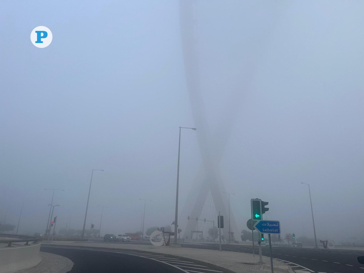 Near-zero visibility due to fog near Al Wahda Arches in Onaiza on Tuesday morning. Pic: Mahmoud Elmazaty / The Peninsula