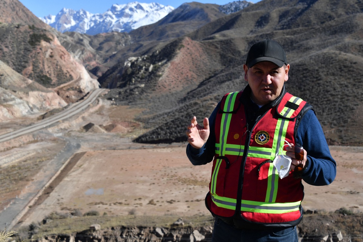 Bakytbek Asankulov, the Kyrgyz emergency situations ministry's employee in charge of radioactive security, stands near new 