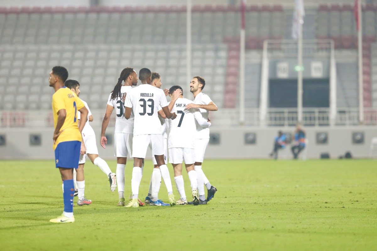 Al Khor players celebrate a goal during the match against Al Gharafa.