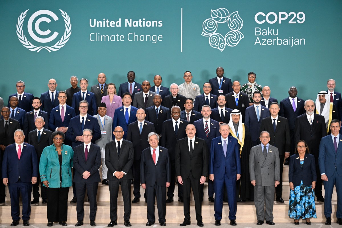 Participating world leaders and delegates pose for a family photo during the United Nations Climate Change Conference (COP29) in Baku on November 12, 2024. Photo by Alexander NEMENOV / AFP.