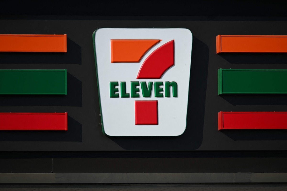 The 7-Eleven logo is displayed on a sign outside of a convenience store in Torrance, California on October 14, 2024. Photo by Patrick T. Fallon / AFP