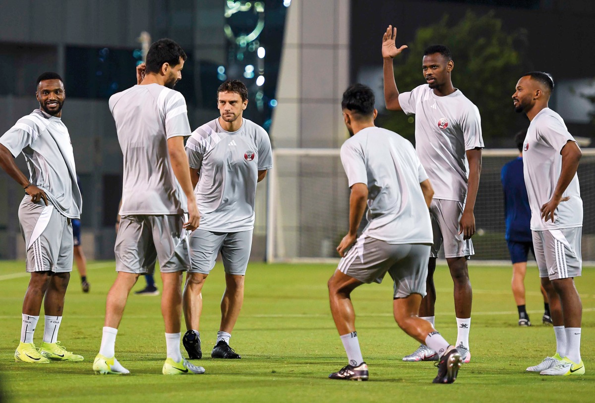 Qatar players take part in a training session ahead of the match yesterday.