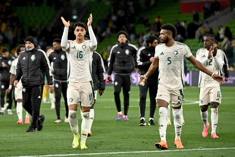 Players from Saudi Arabia react as they walk off the field on November 14, 2024. (Photo by William West / AFP)
