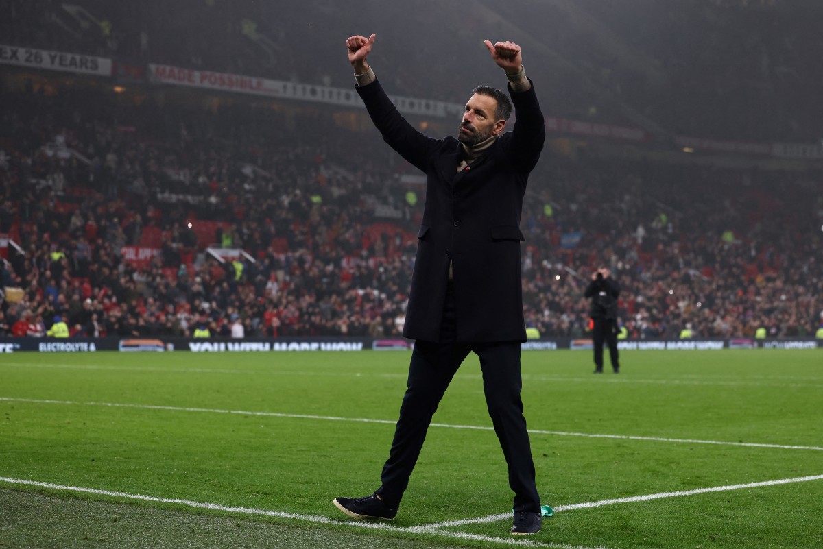 Manchester United's Dutch interim head coach Ruud van Nistelrooy acknowledges fans at the end of the English Premier League football match between Manchester United and Leicester City at Old Trafford in Manchester, north west England, on November 10, 2024. Photo by Darren Staples / AFP.