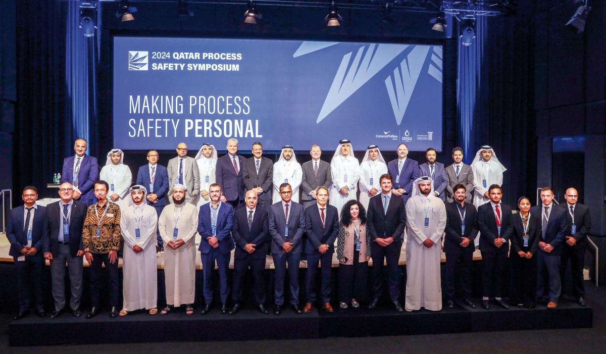 Officials pose for a group photo during the 14th edition of the Qatar Process Safety Symposium.