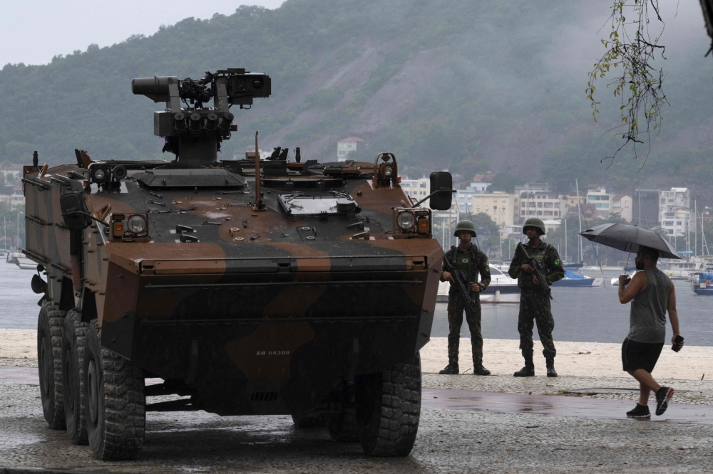 Soldiers patrol at Botafogo Beach as part of the security preparations ahead of the G20 Leaders Summit in Rio de Janeiro, Brazil, on November 16, 2024. (Photo by Pablo Porciuncula / AFP)