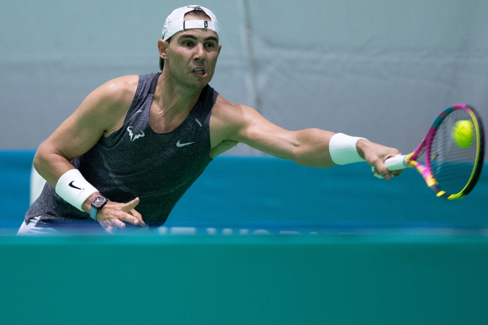 Spain's tennis player Rafael Nadal plays a return during a training session ahead of the Davis Cup tennis tournament at the Martin Carpena sportshall, in Malaga, on November 16, 2024. (Photo by Jorge Guerrero / AFP)
 