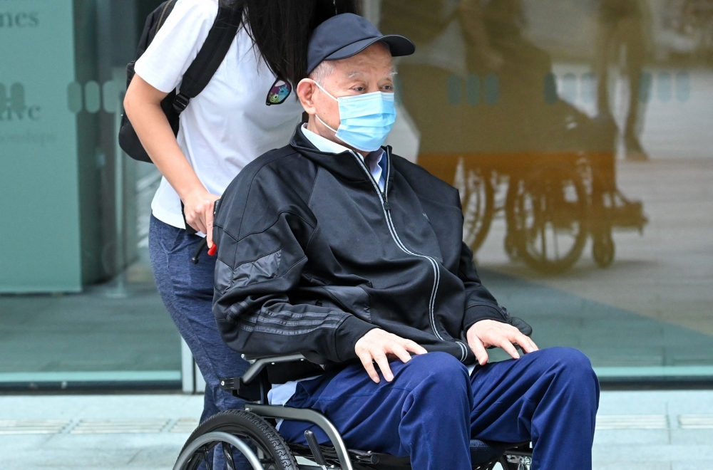 Singapore's former oil tycoon Lim Oon Kuin arrives to be sentenced at the State Court in Singapore on November 18, 2024. (Photo by Roslan Rahman / AFP)