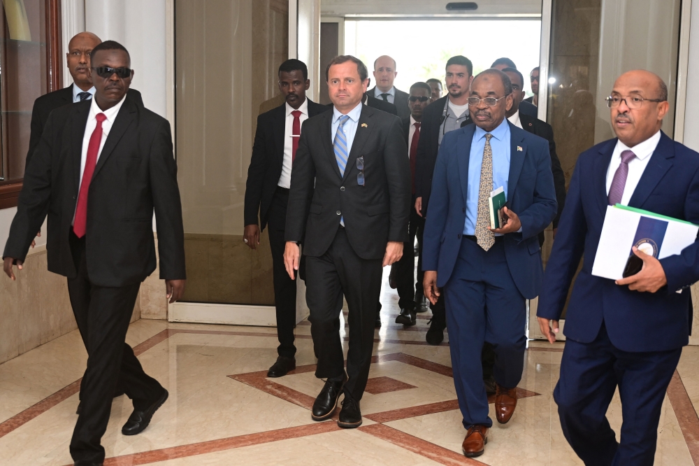 US Special Envoy for Sudan Tom Perriello (centre) is welcomed by local officials upon his arrival in Port Sudan on November 18, 2024. (Photo by AFP)