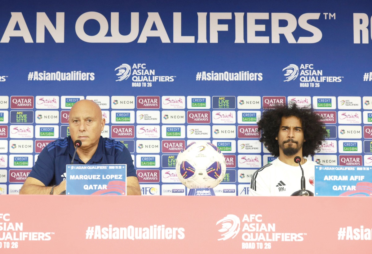 Qatar coach Marquez Lopez (left) and Akram Afif during a pre-match press conference yesterday.