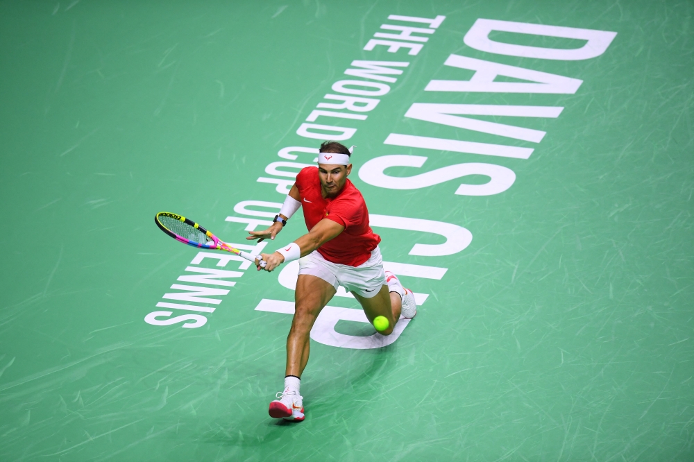 Spain's Rafael Nadal returns a shot to Netherlands' Botic van de Zandschulp in the quarter-final singles match between Netherlands and Spain during the Davis Cup Finals at the Palacio de Deportes Jose Maria Martin Carpena arena in Malaga, southern Spain, on November 19, 2024. (Photo by Jorge Guerrero / AFP)
