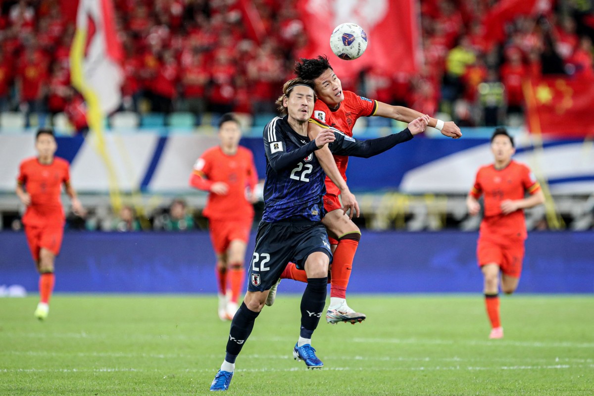 China's Lin Liangming (2R) fights for the ball with Japan's Ayumu Seko (C) during the 2026 FIFA World Cup qualification football match between China and Japan in Xiamen, in southeastern China's Fujian province on November 19, 2024. Photo by STRINGER / AFP.