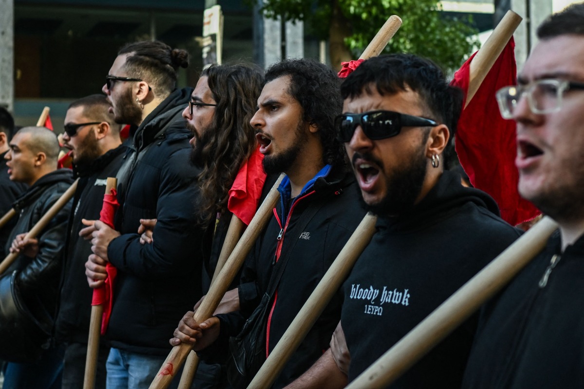 People demonstrate in the streets of Athens on November 20, 2024, during a 24-hour nationwide strike called by unions against the rising cost of living. Photo by Aris MESSINIS / AFP