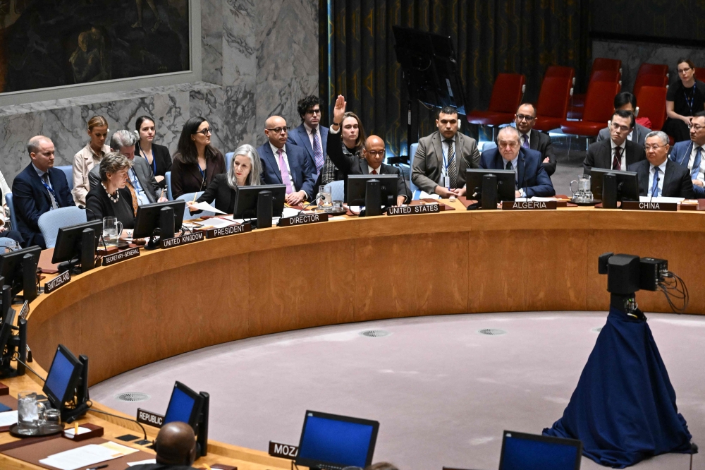 US Alternate Ambassador to the United Nations Robert Wood raises his hand to veto a draft resolution calling for a ceasefire in Gaza, during a United Nations Security Council meeting to discuss the situation in the Middle East on November 20, 2024, at UN headquarters in New York City. (Photo by Angela Weiss / AFP)