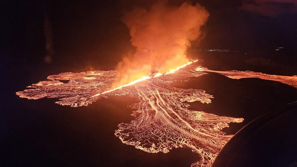 Handout picture released on November 21, 2024 by the Public Defense Department of the State Police Commissioner in Iceland shows Lava and smoke erupting from a volcano near Grindavik on the Icelandic peninsula of Reykjanes. (Photo by Public Defense Department of the State Police / AFP) 
