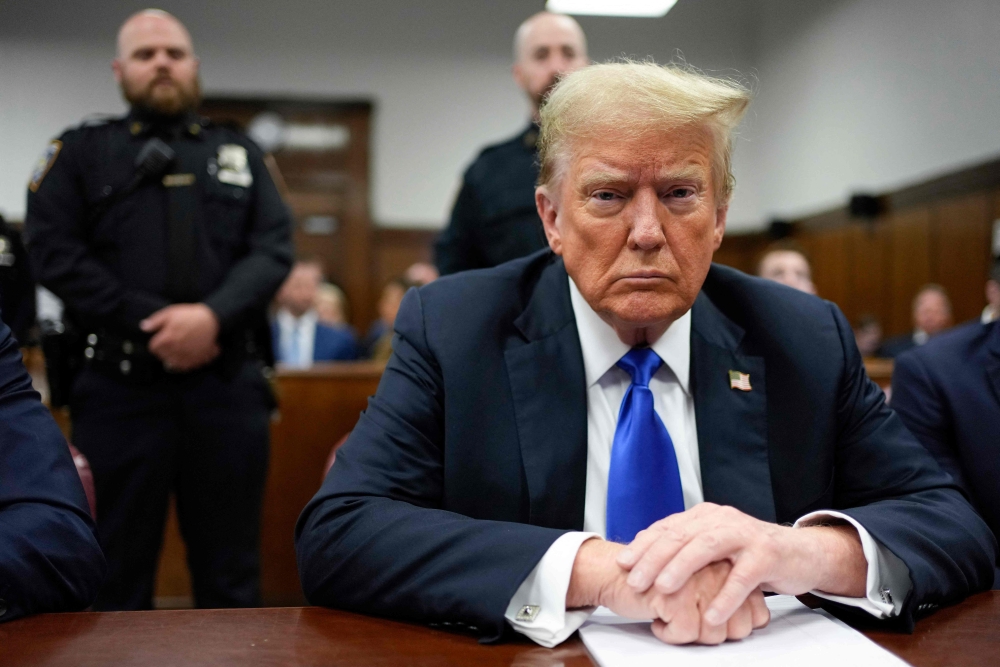 File: Former US President and Republican presidential candidate Donald Trump attends his criminal trial at Manhattan Criminal Court in New York City, on May 30, 2024. (Photo by Seth Wenig / POOL / AFP)