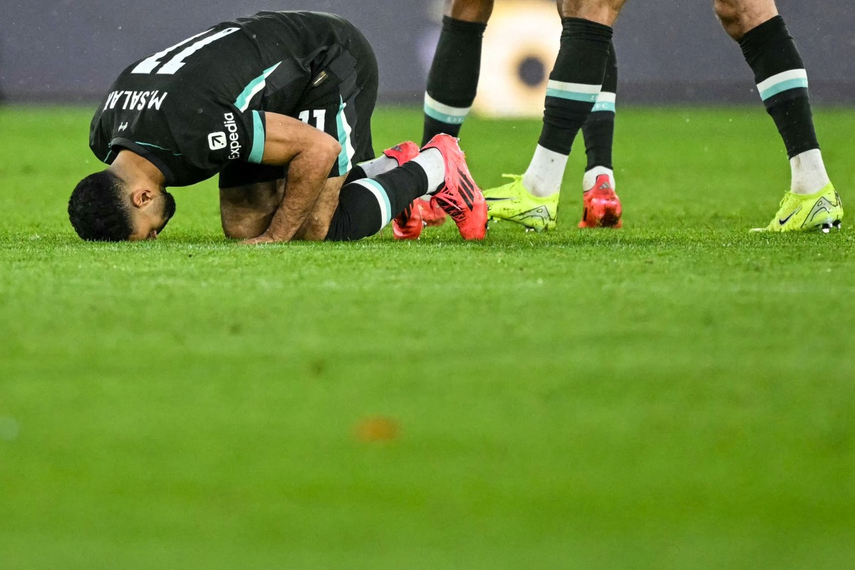 Liverpool's Egyptian striker #11 Mohamed Salah celebrates after scoring his team second goal during the English Premier League football match between Southampton and Liverpool at St Mary's Stadium in Southampton, southern England on November 24, 2024. (Photo by JUSTIN TALLIS / AFP) 