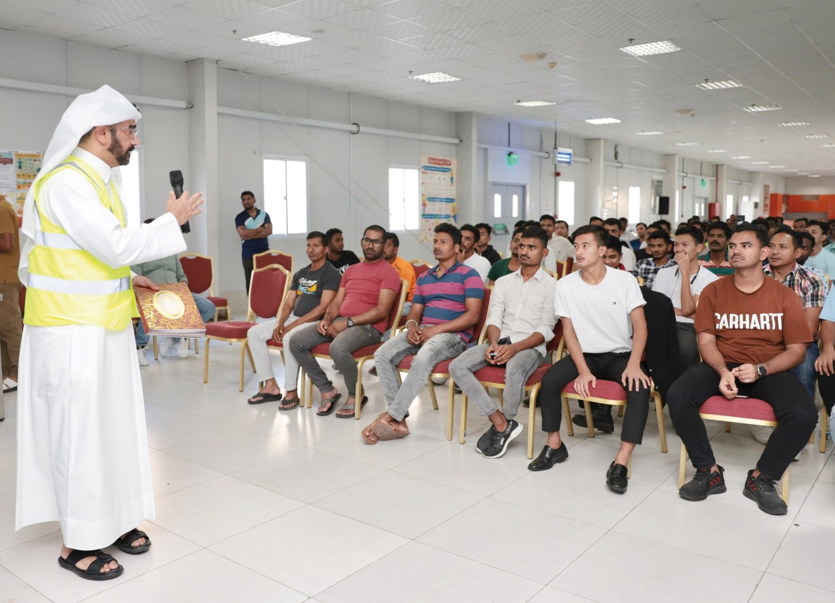 An official briefs workers on occupational safety. 