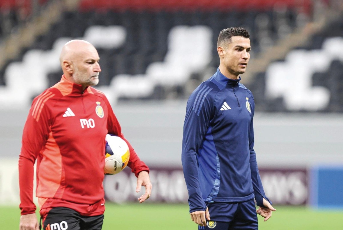 Al Nassr's Cristiano Ronaldo (right) attends a training session on November 24, 2024.