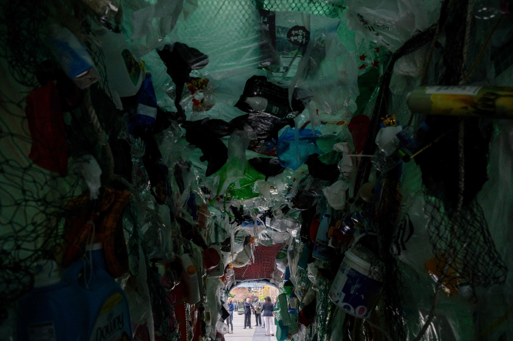 An art installation depicting the inside of a whale lined with plastic waste is seen in Busan on November 25, 2024, before the opening of the Fifth session of UN Intergovernmental Negotiating Committee on Plastic Pollution (INC-5). (Photo by ANTHONY WALLACE / AFP)