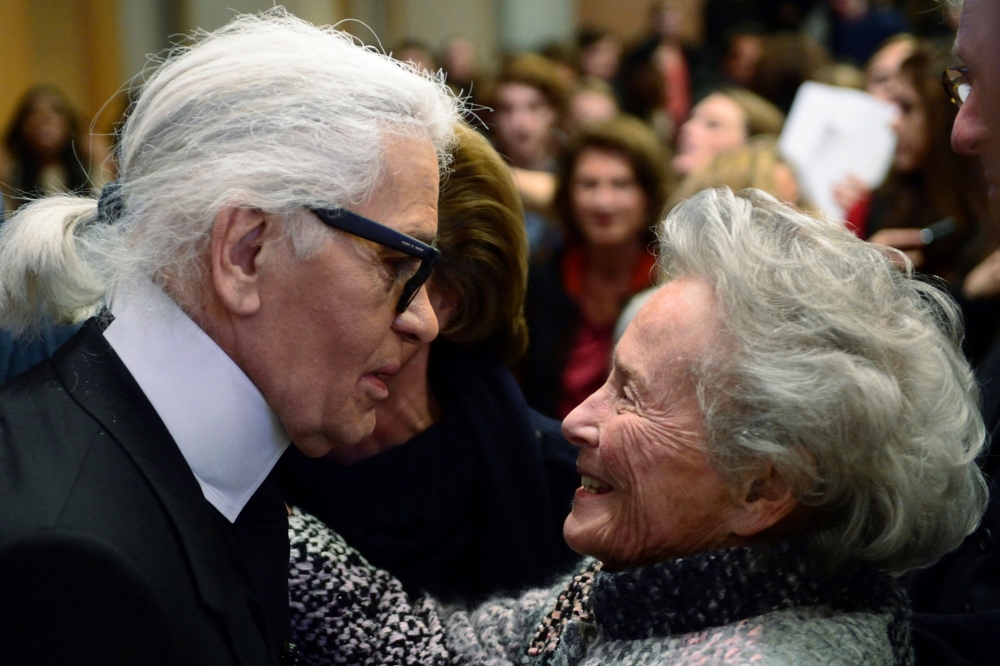 German fashion designer Karl Lagerfeld (L) meets Eliane Heilbronn, mother of the main Chanel shareholder, at the Institute of Political Studies (IEP) or 