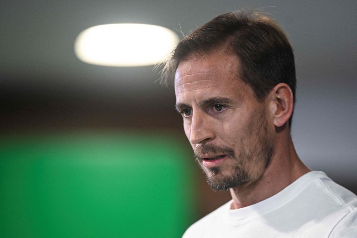 Sporting's coach Joao Pereira arrives to give a press conference on the eve of their UEFA Champions League football match against Arsenal FC at Alvalade stadium in Lisbon, on November 25, 2024. (Photo by Patricia DE MELO MOREIRA / AFP)