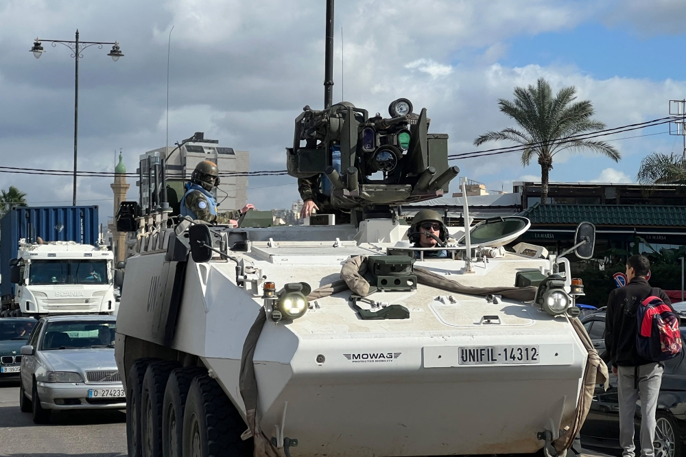 A United Nations Interim Force in Lebanon (UNIFIL) armoured vehicle drives through the southern Lebanese city of Sidon on November 25, 2024. (Photo by Mahmoud Zayyat / AFP)