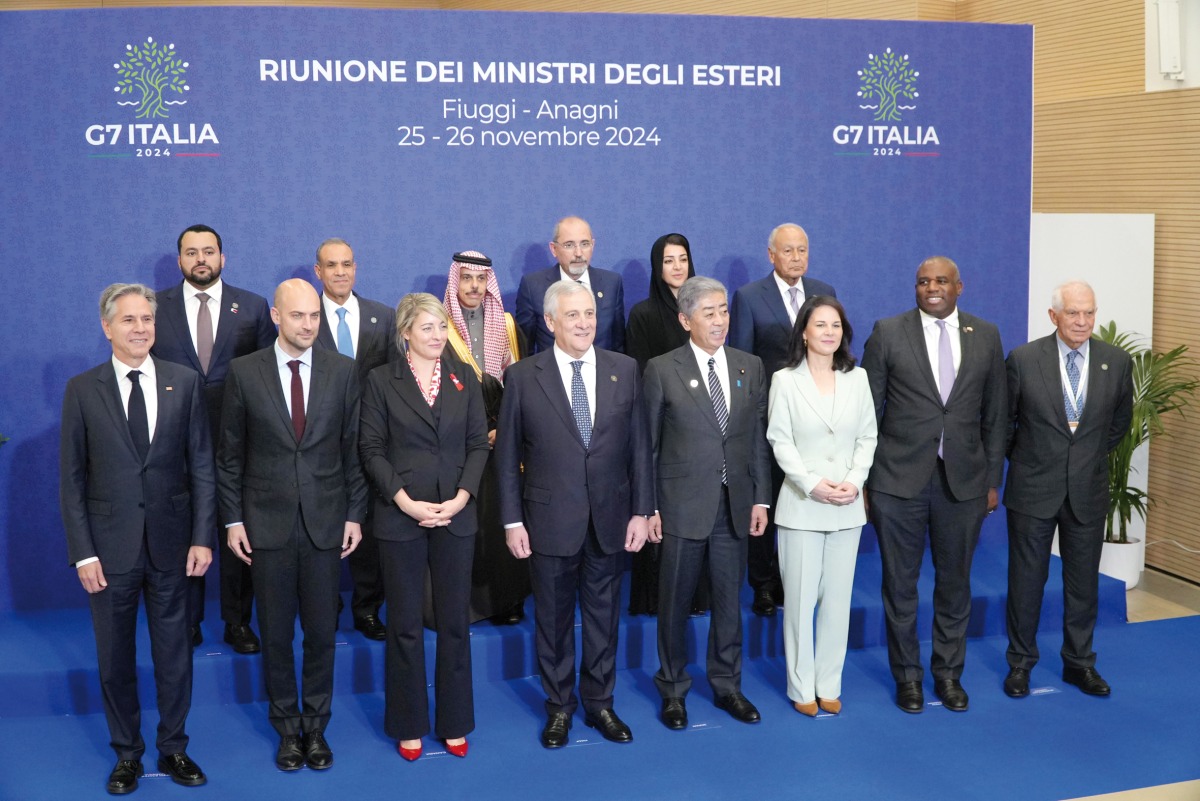 Minister of State at the Ministry of Foreign Affairs H E Dr. Mohammed bin Abdulaziz bin Saleh Al Khulaifi (left, backrow) with other participants at the event.