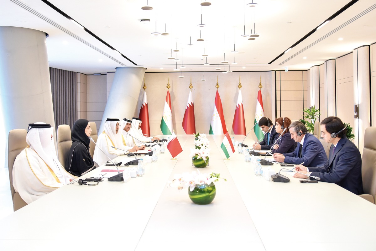 Minister of Labour H E Dr. Ali bin Smaikh Al Marri with Minister of Labour, Migration, and Employment of the Republic of Tajikistan H E Khasanzoda Gulnora Kenja and other delegates at the meeting.