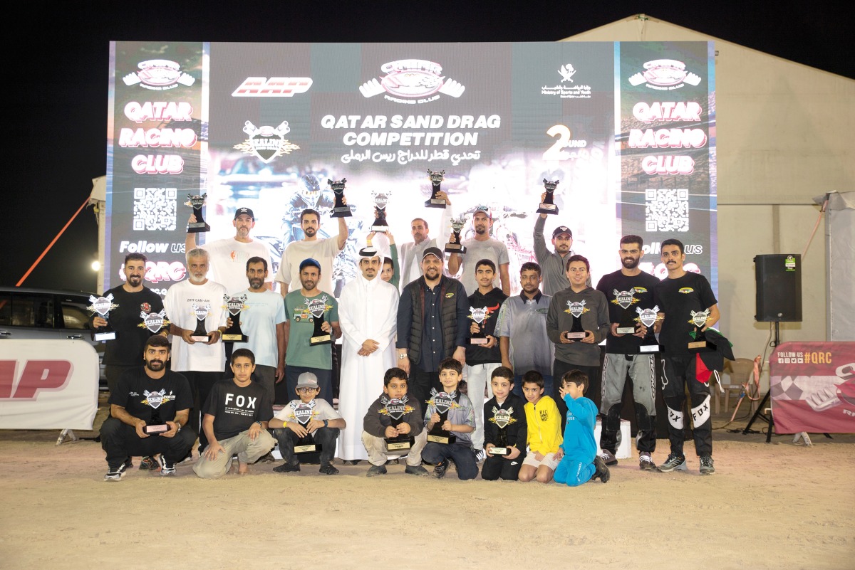 Qatar Racing Club Director H E Sheikh Jabor bin Khalid Al Thani poses for a photo with the podium winners. 
