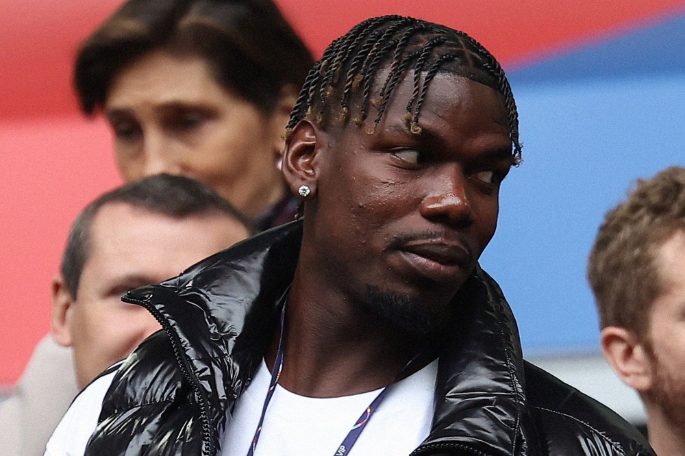 (FILES) French midfielder paul Pogba (L) attends the UEFA Euro 2024 round of 16 football match between France and Belgium at the Duesseldorf Arena in Duesseldorf on July 1, 2024. (Photo by FRANCK FIFE / AFP)