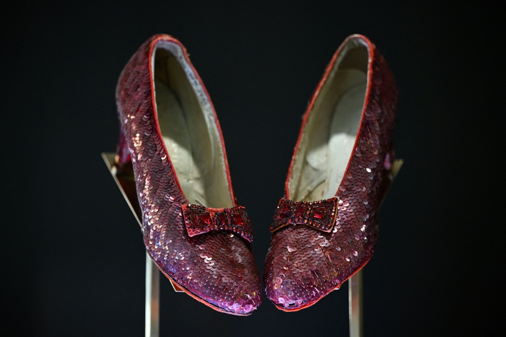 The ruby slippers worn by US actress and singer Judy Garland in the 1939 film The Wizard of Oz are pictured on display in London on November 27, 2024. (Photo by Justin Tallis / AFP)