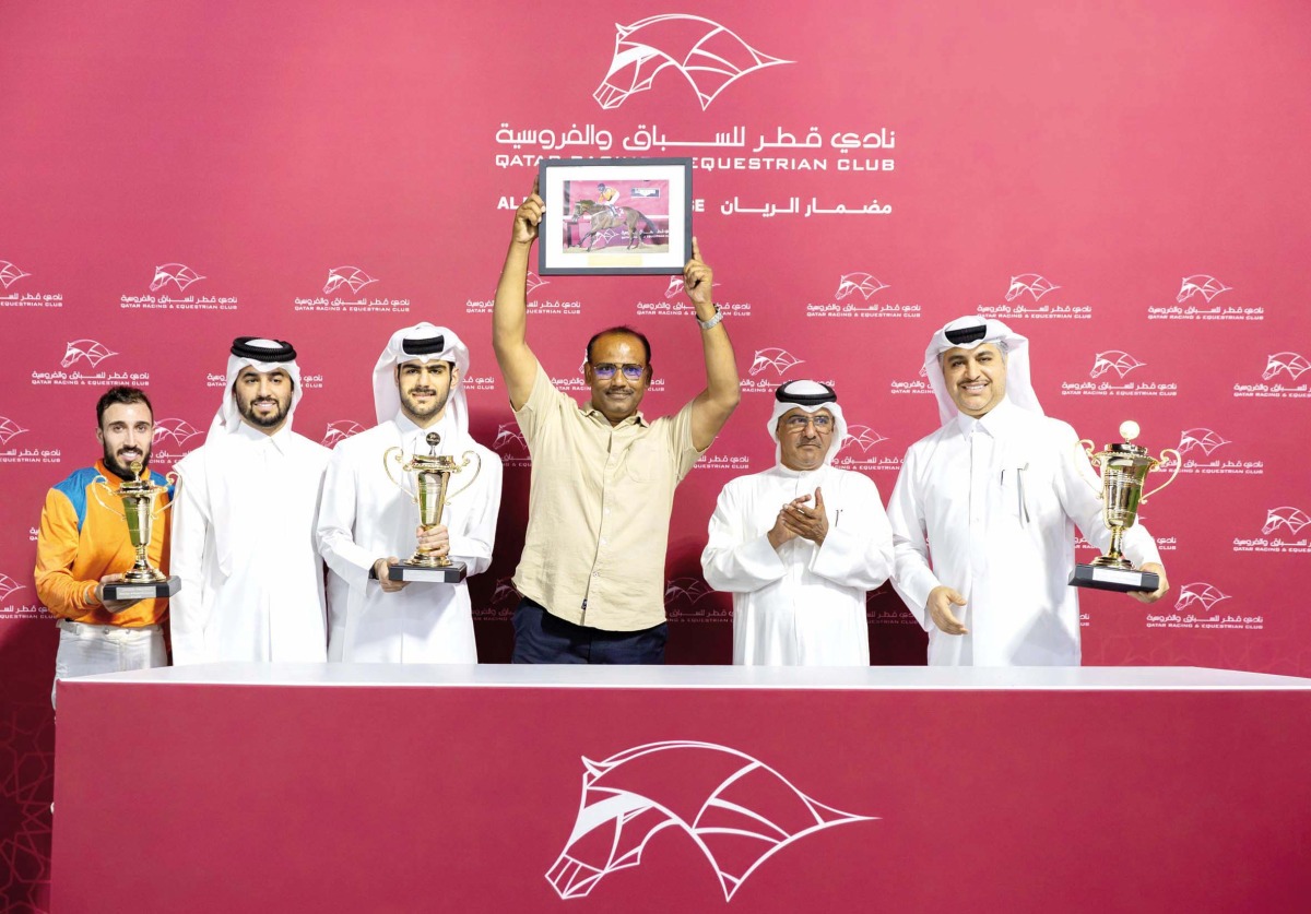 The connections of Dubawi Spectre celebrate after winning the Doha Cup. QREC Racing Manager Abdulla Rashid Al Kubaisi crowned the winners. Pic: Juhaim/QREC