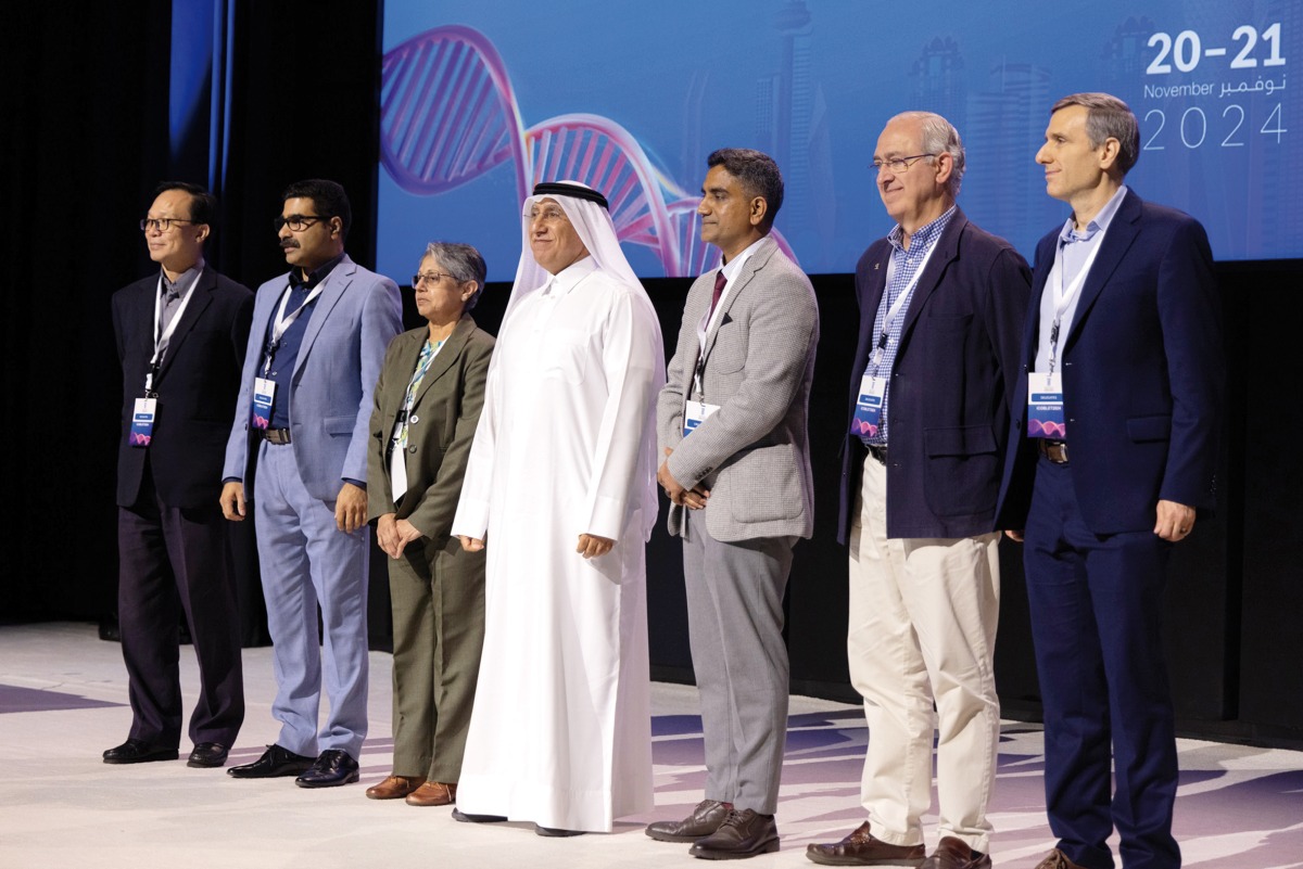 President of UDST Dr. Salem Al Naemi (centre) with other participants during the event.