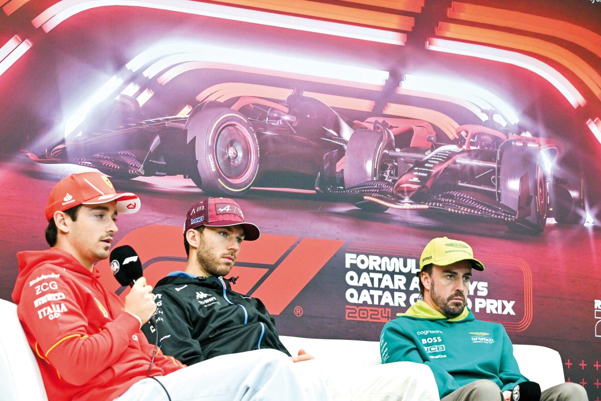 FROM LEFT: Ferrari’s Monegasque driver Charles Leclerc, Alpine’s French driver Pierre Gasly and Aston Martin’s Spanish driver Fernando Alonso during a press conference ahead of the Qatari Formula One Grand Prix at the Lusail International Circuit yesterday. AFP