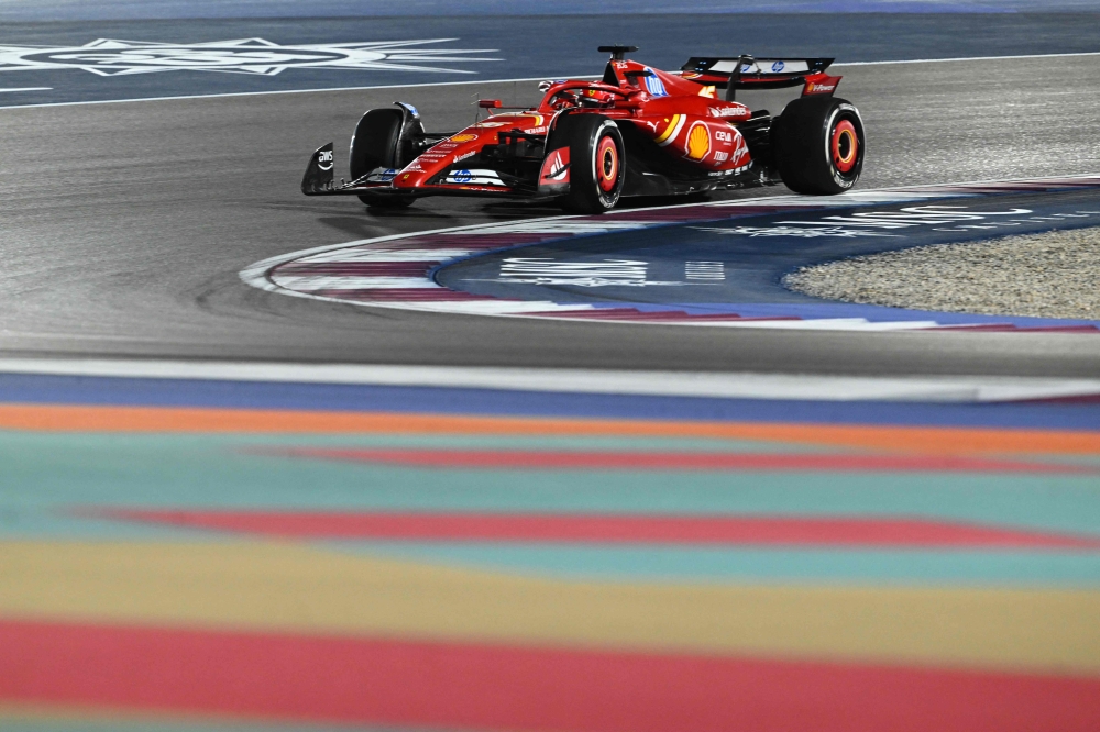 Ferrari's Monegasque driver Charles Leclerc drives during the first practice session of the Formula One Qatar Grand Prix at the Lusail International Circuit on November 29, 2024. (Photo by Mahmud Hams / AFP)