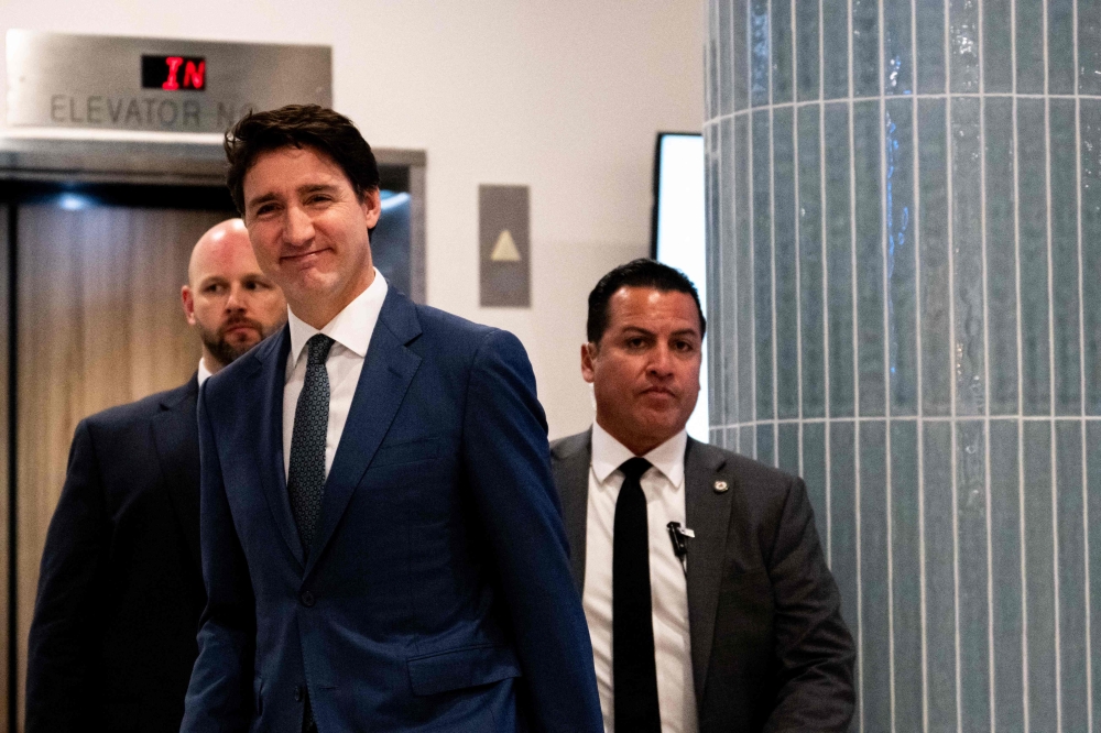 Canadian Prime Minister Justin Trudeau exits the Delta Hotels by Marriott West Palm Beach ahead of a meeting with US President-elect Donald Trump on November 29, 2024 in Palm Beach, Florida. Brandon Bell/Getty Images/AFP 