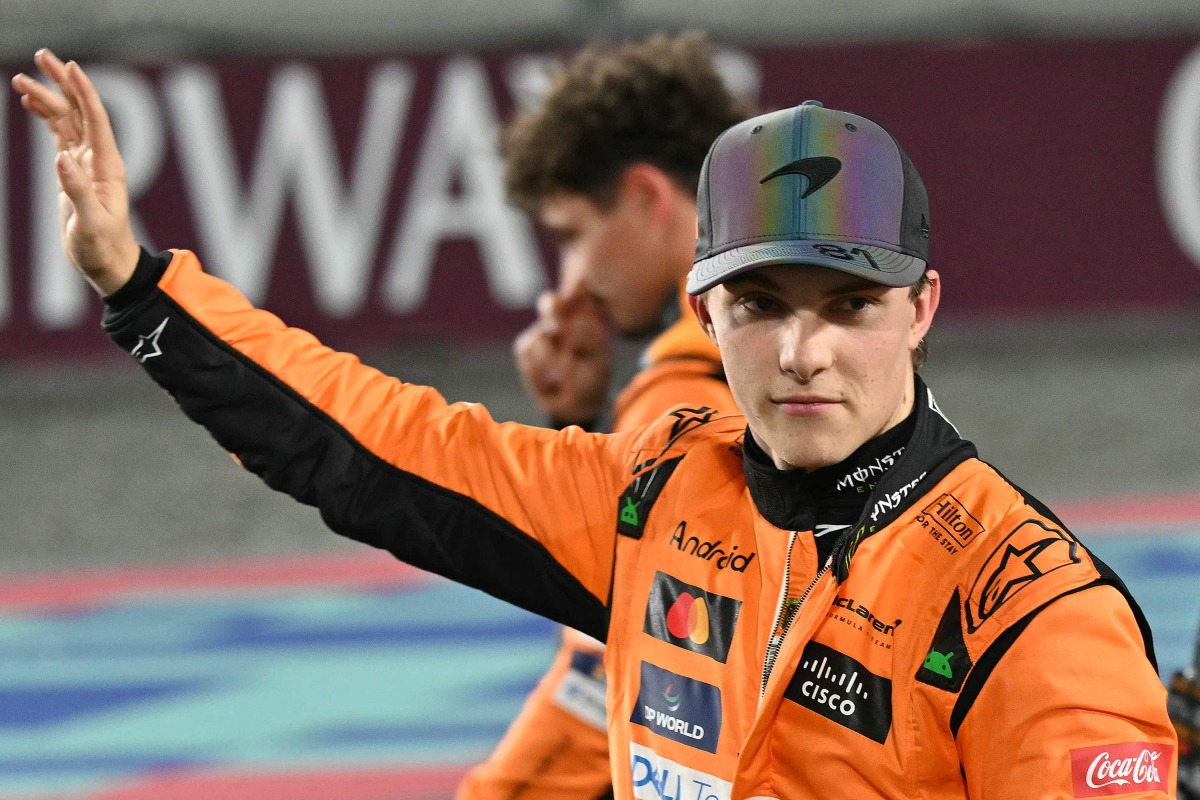 McLaren's Australian driver Oscar Piastri waves to the crowd after winning the sprint race ahead of the Qatari Formula One Grand Prix. 