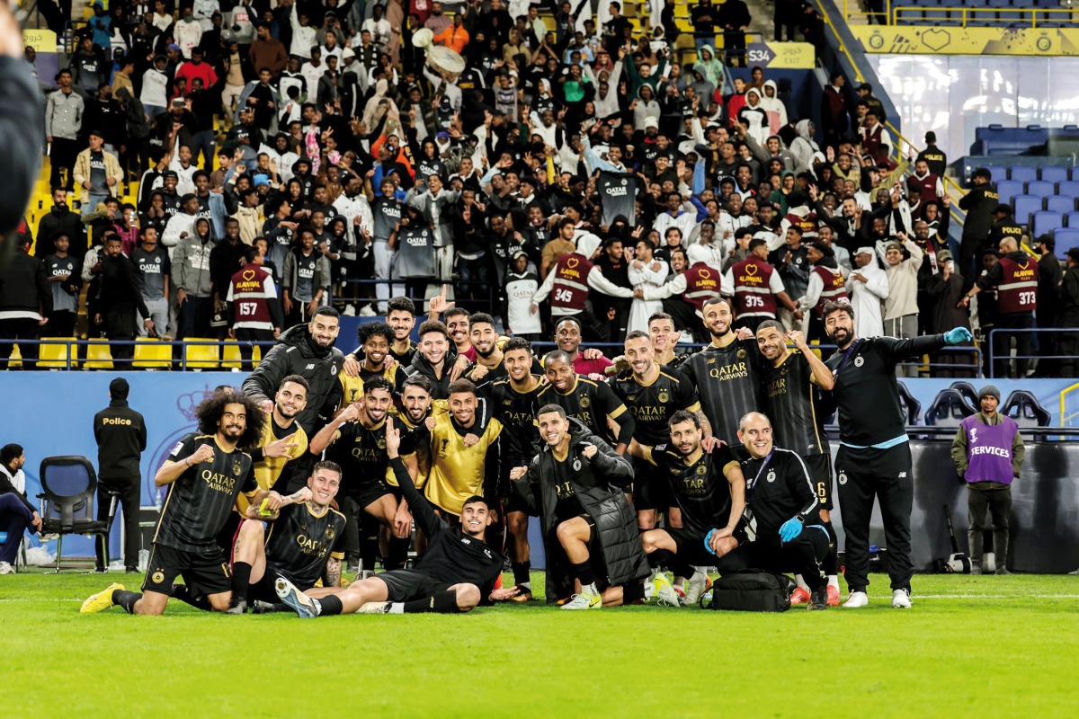 Al Sadd players celebrate their victory.