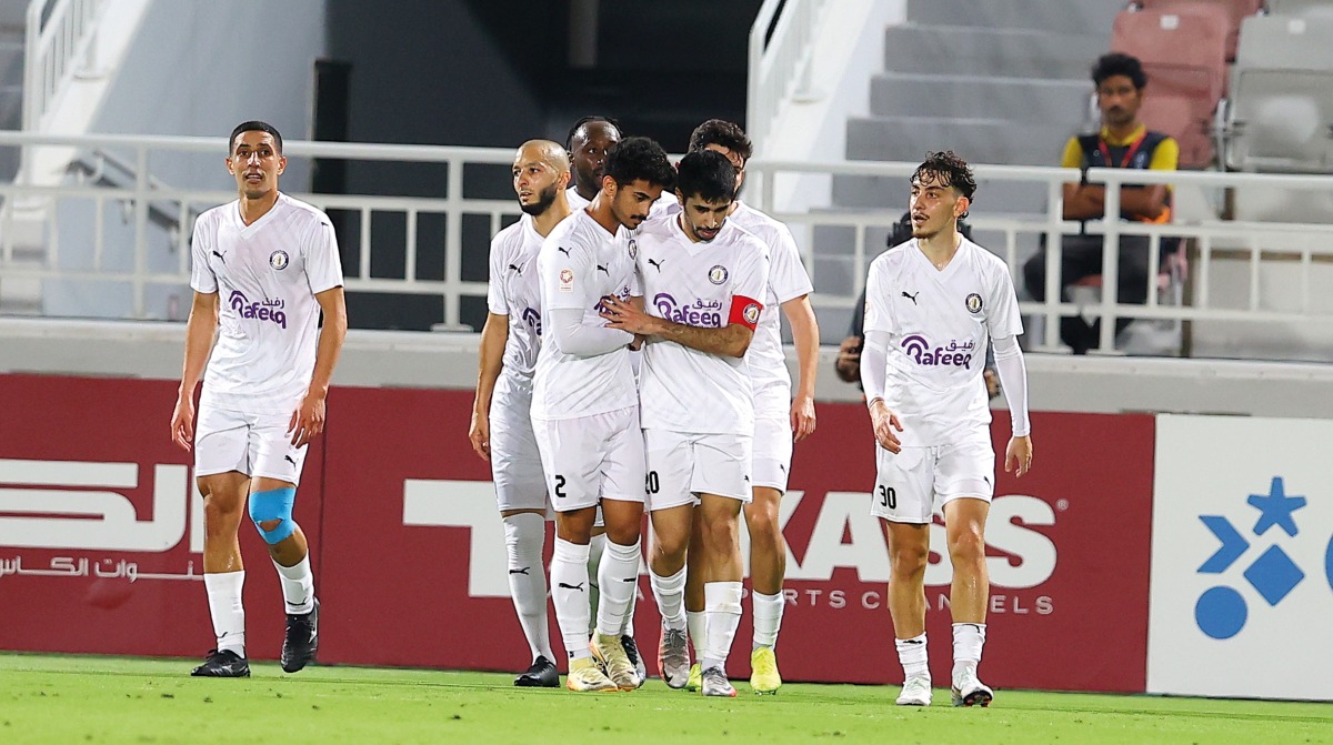 Al Khor captain Ahmad Hassan Al Mohannadi celebrates with teammates after scoring their first goal.