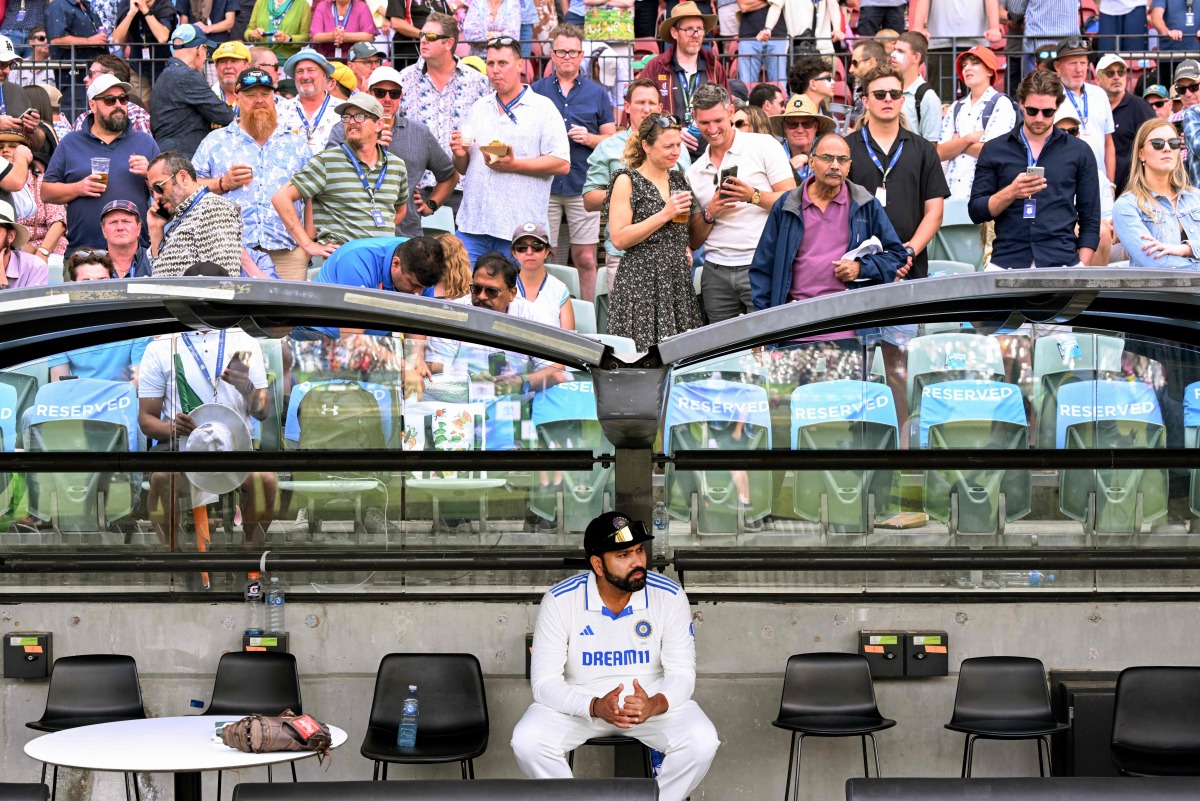 India's captain Rohit Sharma waits for the after-match presentation on on the third day of the second cricket Test match between Australia and India at the Adelaide Oval in Adelaide on December 8, 2024. (Photo by William WEST / AFP)