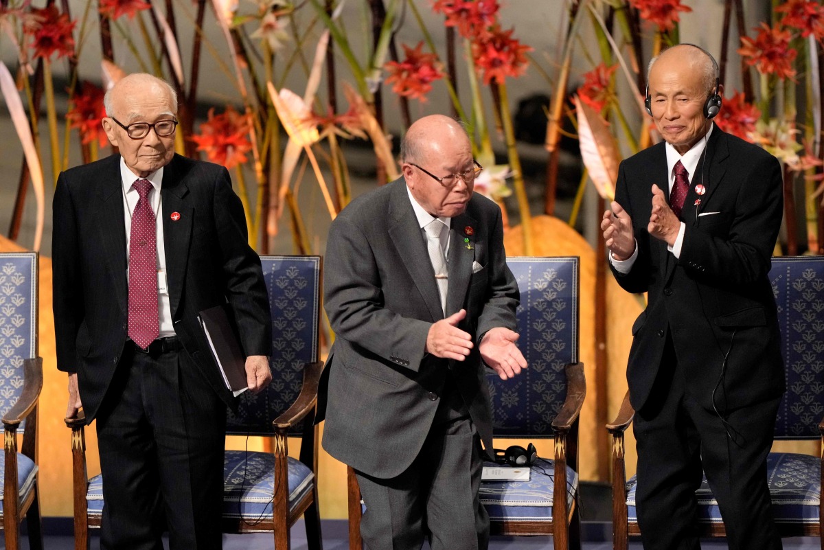 The representatives of the 2024 Nobel Peace Prize winner Japan's atomic bomb survivors' group Nihon Hidankyo, Terumi Tanaka, Shigemitsu Tanaka and Toshiyuki Mimaki applaud during the Nobel Peace Prize award ceremony at the Oslo City Hall in Oslo, Norway on December 10, 2024. Photo by Javad Parsa / NTB / AFP